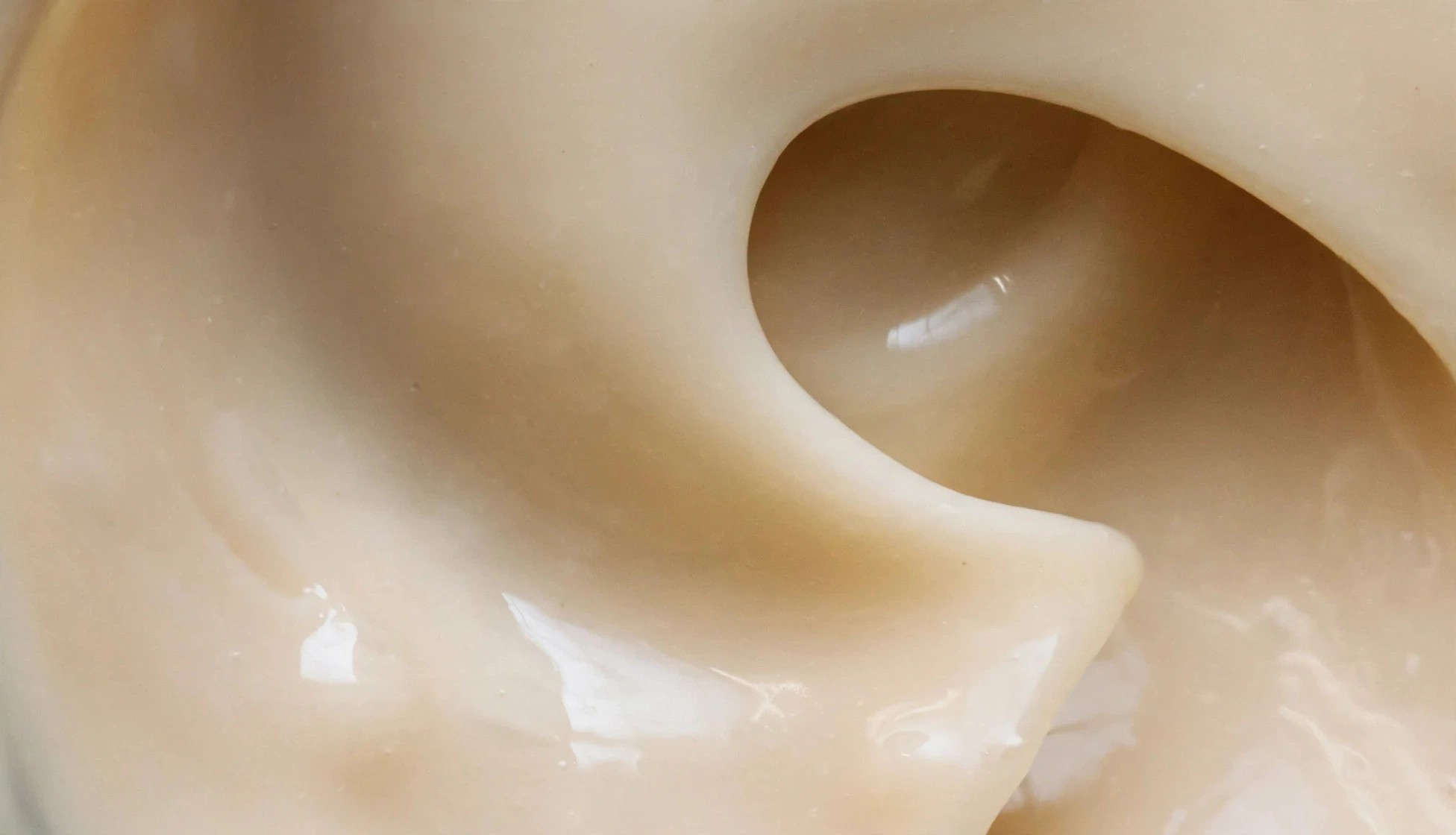 Close view of smooth cream showing its rich consistency.