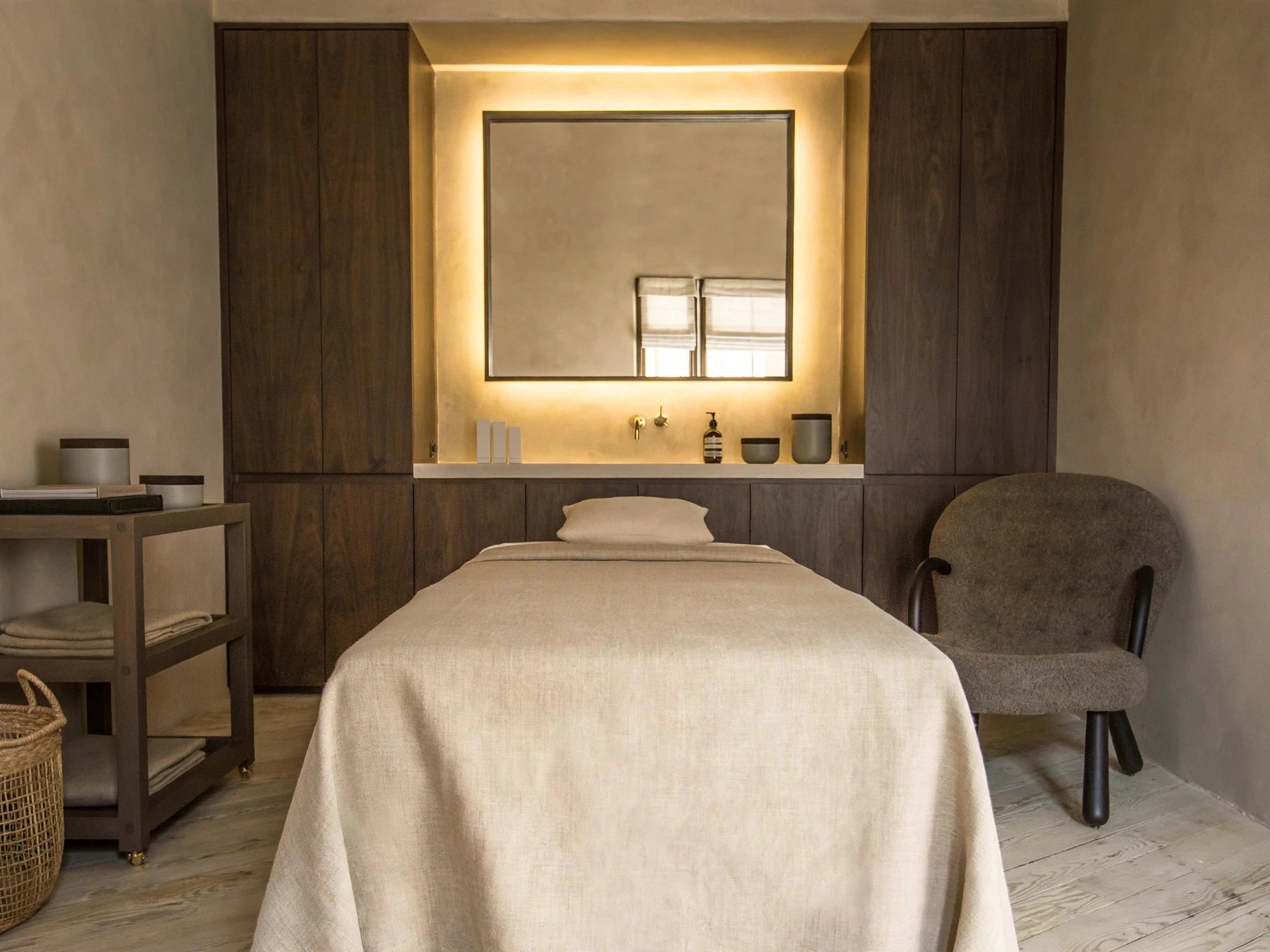 treatment bed centered in the warm studio interior.