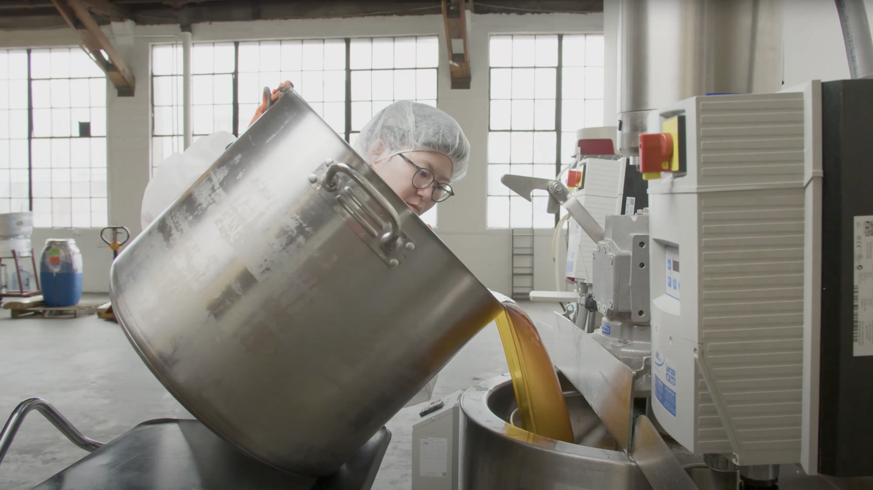 Fresh lotion flowing from a steel tank across the floor of Stratia's own Los Angeles lab.